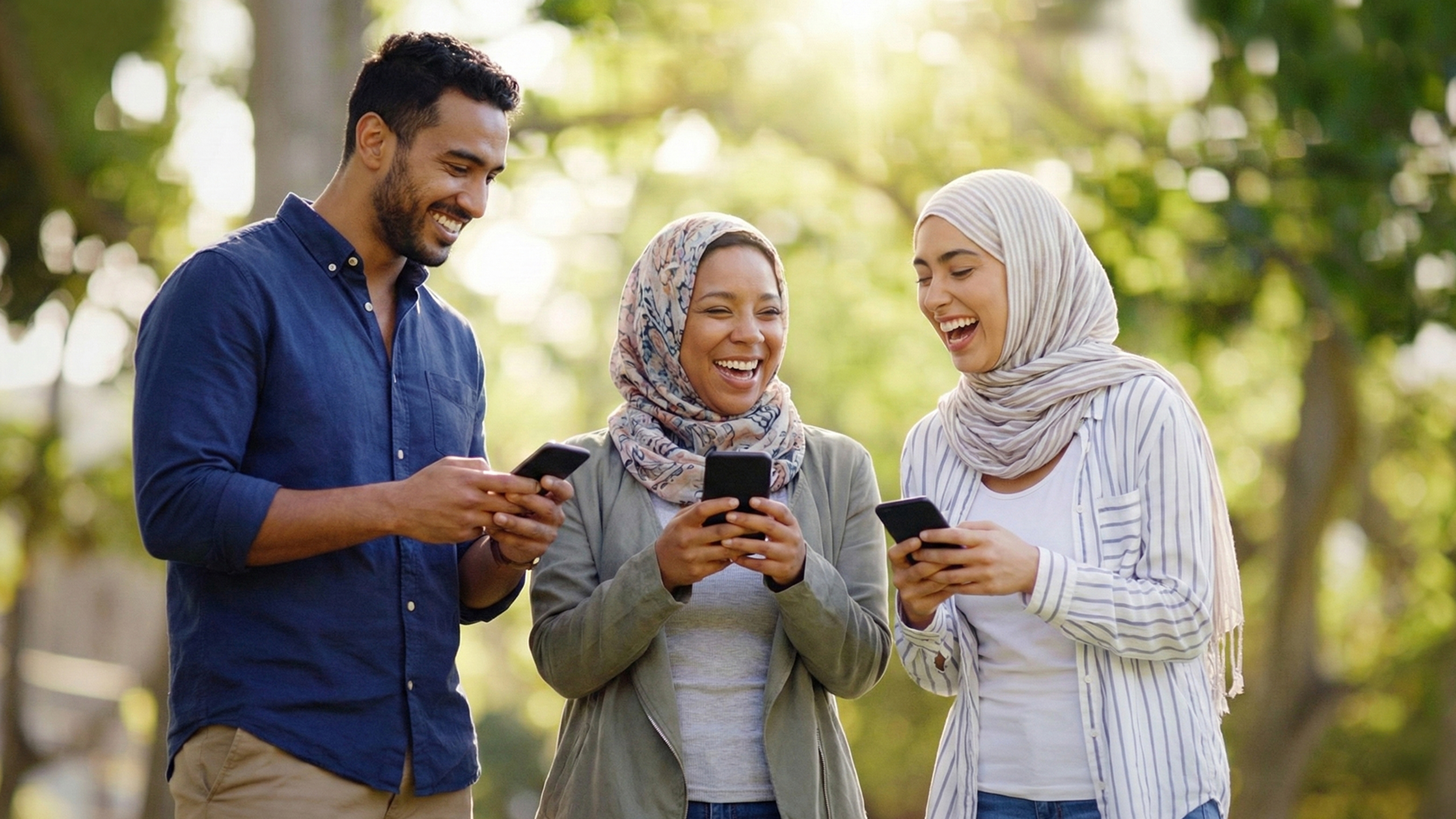 A group of people looking at their phones
